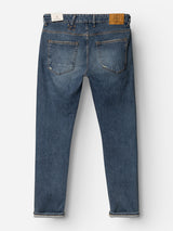 A pair of BGrepi Presley Jeans in Denim Blue by Blue de Gênes shown from the back, featuring two rear pockets, visible stitching, a leather patch on the waistband, and slightly rolled cuffs at the bottom. Crafted from comfort stretch denim, these durable jeans blend style with lasting wear.