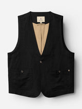 The BGduncan Ian Gilet by Blue de Gênes is a black sleeveless vest made from lightweight textured fabric, featuring two front buttoned pockets, a beige lining, V-neckline, and secured with two buttons at the front, shown against a white background.
