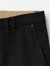 Close-up of the waistband and upper section of the BGpalco Ian Pant - Black by Blue de Gênes, highlighting a belt loop, tan inner lining, stitch detail near the pocket, and textured linen wool fabric with a subtly tapered silhouette.