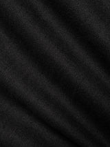 Close-up of black fabric from the BGpalco Ian Pant by Blue de Gênes, highlighting the visible diagonal weave pattern and soft folds that create subtle shadows and rich texture—ideal for crafting relaxed fit or elegantly tapered trousers.