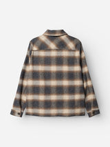 The Blue de Gênes BGyodo Check Overshirt in Grey Check is a men’s regular fit, long-sleeve button-up shirt featuring a brown, beige, and gray plaid pattern, shown from the back against a white background.