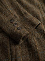 Close-up of the BGleopardi Skotch Blazer - Brown Check by Blue de Gênes, highlighting the brown wool sleeve with a subtle textured check pattern and three dark horn buttons on the cuff.