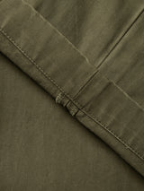Close-up of the BGmenzo Rory Chino - Army by Blue de Gênes, featuring olive green fabric with a subtle herringbone pattern and neatly stitched hem that highlights its detailed texture and refined craftsmanship—ideal for a classic chino fit or pairing with a matching blazer and washed herringbone trousers.