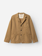 The BGgabbiano Rory Blazer - Khaki by Blue de Gênes is a long-sleeved cotton chore jacket, crafted from washed herringbone fabric in tan. It features three front patch pockets and black buttons, shown against a plain white background. Its unconstructed design offers the laid-back comfort of a relaxed blazer.