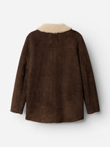 The BGseras Shearling Coat by Blue de Gênes is a dark brown cold-weather jacket, pictured from the back against a plain white background. Featuring long sleeves, light tan shearling lining, and visible seam details, this coat combines warmth and style for chilly days.