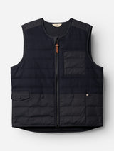 Introducing the BGdand Waistcoat in Dark Navy by Blue de Gênes—a quilted waistcoat featuring a front zipper, one chest pocket, two flap front pockets, and a subtle logo detail on the right front. With its slightly padded texture and sleek, modern silhouette, this vest delivers the practical versatility of a classic utility waistcoat.