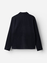 Back view of the BGlewis Wool Blazer in dark navy by Blue de Gênes, featuring long sleeves, relaxed tailoring, a straight hem, and a subtle collar, shown against a plain white background.