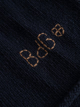 Close-up of the Blue de Gênes BGgordon Knit - Dark Navy sweater featuring “BB6” embroidered in light brown thread.