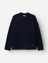 The BGgordon Knit - Dark Navy from Blue de Gênes is a classic wool sweater in plain dark navy, featuring a crew neckline and ribbed cuffs. Displayed against a white background, this timeless piece includes subtle tan embroidery near the left hem.