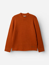 A BGgordon Knit sweater by Blue de Gênes in Ginger Bread Orange, featuring a crew neckline, long sleeves, and ribbed cuffs, is displayed on a white background.