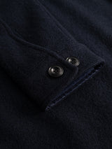 Close-up of the BGhew Wool Overshirt by Blue de Gênes in Dark Navy, highlighting the felted wool fabric texture and two black buttons on the sleeve.