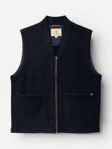 The BGmudock Wool Waistcoat - Dark Navy by Blue de Gênes is a sleeveless, zip-up boiled wool waistcoat in dark navy, featuring two front pockets and a small metal detail on the right pocket, shown against a plain white background.