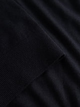 Close-up of the BGhamish Crewneck Knit in Dark Navy by Blue de Gênes, highlighting the ribbed cuff or hem contrasted against a smoother, flat section of the same lightweight knit fabric.