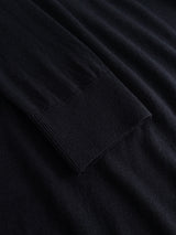 Close-up of the BGigor Polo Knit in Dark Navy by Blue de Gênes, showcasing a men’s long-sleeve polo crafted from fine-gauge knit, with emphasis on the ribbed cuff and smooth fabric texture.