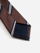 Close-up of the BGcarl Tie - Ginger Bread Orange by Blue de Gênes, featuring brown with diagonal navy and white stripes, highlighting the pointed tip and inner lining on a plain white background—a classic men’s accessory designed for timeless style.