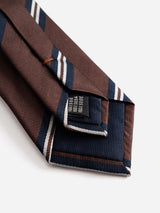 A close-up of the BGcarl Tie - Ginger Bread Orange by Blue de Gênes, neatly folded to reveal a label with washing instructions sewn on the back—a classic men’s accessory designed for both style and sophistication.