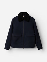 The BGdugal Bomber Jacket - Dark Navy by Blue de Gênes, featuring a black faux fur teddy collar, front zipper closure, and two large front flap pockets, is showcased against a plain white background.
