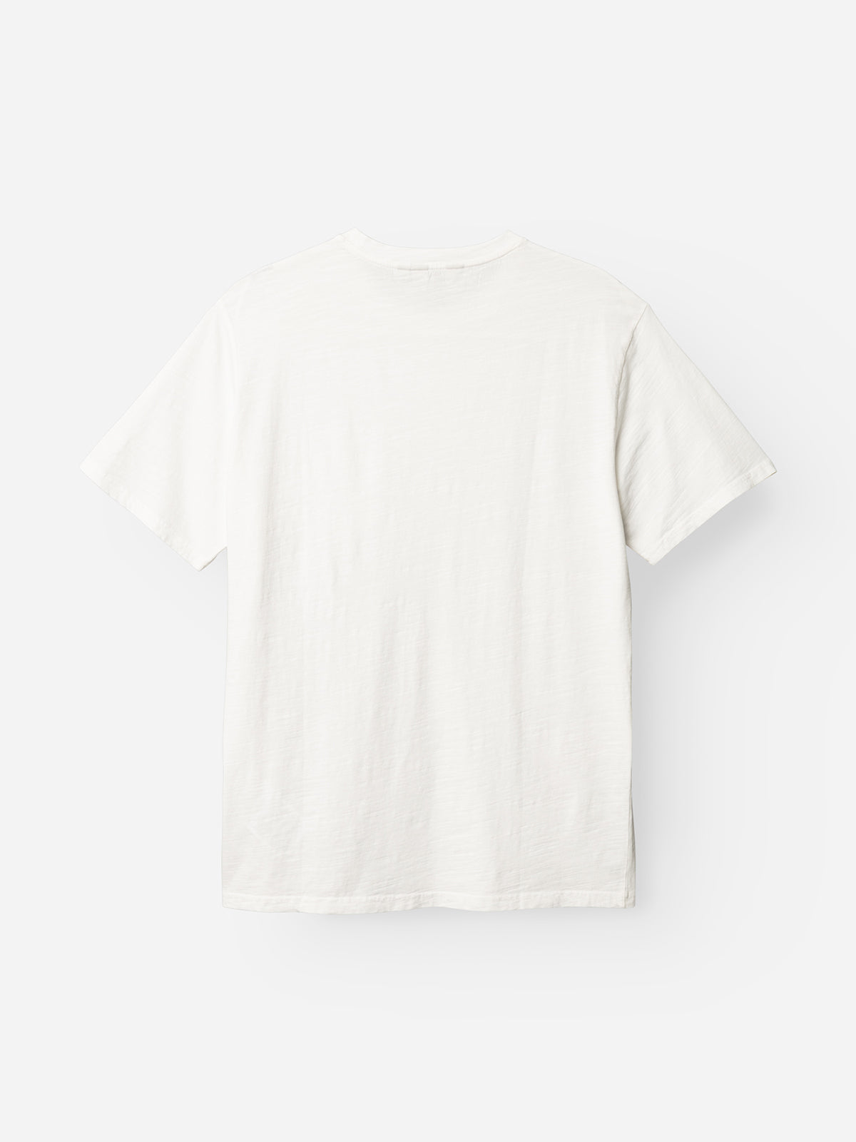 The BGoscar T-Shirt - Snow Fall by Blue de Gênes is shown from the back against a light background. Made from soft slub cotton, it features short sleeves and a plain white design with no visible logos or patterns.