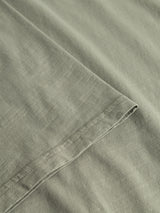 Close-up of the hem and fabric texture of the BGoscar T-Shirt - Shadow Green by Blue de Gênes, featuring neat stitching and soft slub cotton material.