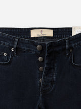 Close-up of the waistband and fly on BGvinci Black OD Jeans by Blue de Gênes in blue-black denim, featuring a comfort stretch fit, five pockets, four visible metal buttons, front pockets, and an inner waistband label with the brand name.