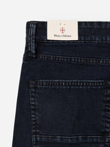 Close-up of the back pocket and waistband of Blue de Gênes BGvinci Black OD Jeans in blue-black denim, featuring a rectangular brand tag above the pocket.