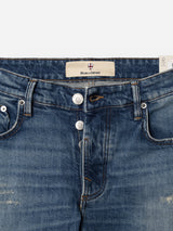Close-up of the BGvinci Break Jeans - Denim wash by Blue de Gênes, crafted from comfort stretch denim. These regular fit jeans feature a button fly, visible stitching, and a Blue de Gênes label inside the waistband. Subtle distressed details add unique character to the design.