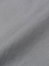 Close-up of flint gray textured fabric with a subtle grid pattern and gentle folds, giving the surface a soft, wavy appearance—echoing the refined feel of the BGpaulo Teo Pant by Blue de Gênes.