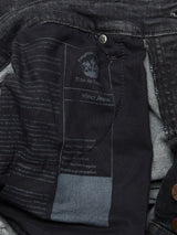 Close-up of the inside pocket of the Vinci G Dark Grey Jeans by Blue de Gênes, revealing printed text and branding details on the inner fabric lining. Expertly crafted in Italy from comfort stretch denim, these regular fit grey jeans offer a blend of style and quality.