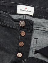 Close-up of Blue de Gênes Vinci G Dark Grey Jeans, featuring copper buttons and a visible "Blue de Gênes" label stitched inside the waistband. The grey denim jeans are partially unbuttoned, revealing the inner fabric made from comfort stretch denim.