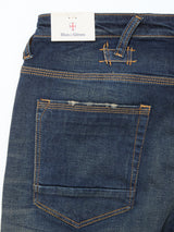 Close-up of the back pocket and waistband of Repi Dark Vintage Jeans - Mid Blue Denim by Blue de Gênes, featuring orange stitching, a white Blue de Gênes tag on a belt loop, and comfortable stretch denim in a dark vintage wash.