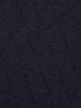 Close-up of the Blue de Gênes BGwally Diamond Polo in Dark Navy, featuring a cotton linen blend fabric with a diamond-shaped quilted pattern and raised stitched lines forming a grid across the material.