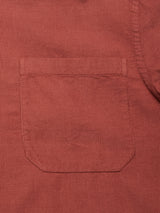 Close-up of the Zamboni Velu Shirt - Henna by Blue de Gênes, showing a single front pocket with visible stitching and fine corduroy ridges that highlight the rich color and texture of this garment-dyed piece.