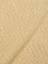 Close-up of the BGyale Slubby Crewneck Knit in Pale Khaki by Blue de Gênes, showing its soft, textured beige fabric with a diagonal ribbed pattern and slubby finish.