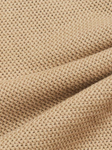 Close-up of the Blue de Gênes Filo Knit Polo in khaki, showcasing its beige waffle-knit fabric with a textured grid pattern and gentle folds, giving it a soft and cozy look.