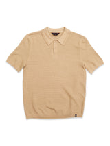 The Blue de Gênes Filo Knit Polo in khaki features short sleeves, a ribbed collar, three-button placket, and a subtle textured pattern, shown laid flat on a white background.