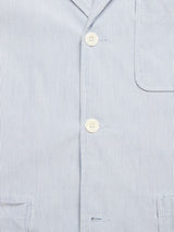 Close-up of the Gabbiano Riga Blazer by Blue de Gênes in blue stripes, featuring white buttons and a partially visible pocket—a relaxed, stylish choice for any occasion.