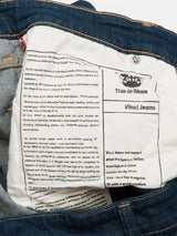 The Vinci Topaz Jeans - Rinse Wash by Blue de Gênes feature an inside pocket with black-on-white Leonardo da Vinci text, blue denim edges, and copper stitching—all crafted in Italy for comfort and style.