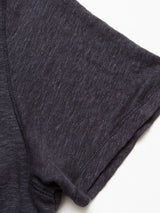 Close-up of the short sleeve of the Blue de Gênes Totti T-Shirt in dark navy, featuring a textured knit and soft, slightly heathered fabric, lying flat on a white background.