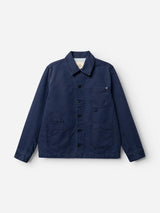 The BGcuddy Nebraska Jacket - Blue by Blue de Gênes is crafted from high-density dobby weave cotton and features a collar, button front, and three front pockets, shown here in navy blue against a white background.