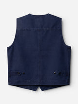 The BGlumen Nebraska Gilet - Blue by Blue de Gênes is displayed flat from the back, showcasing its classic workwear waistcoat style in navy blue. Crafted from high-density cotton, it features two small buttoned pockets near the bottom hem and visible stitching along the seams.