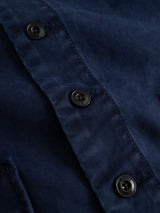 Close-up of the BGlumen Nebraska Gilet in blue by Blue de Gênes, showcasing three black buttons, visible stitching along the placket, and a subtle dobby weave inspired by classic workwear waistcoat designs.
