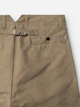 Close-up of the BGliam Nebraska Chino - Brown by Blue de Gênes, highlighting the back pocket with a black button, a small adjustable buckle strap above the pocket, and stitched belt loops at the waistband.