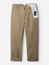 BGliam Nebraska Chino - Brown trousers by Blue de Gênes, crafted from khaki-colored cotton chino fabric, feature cuffed hems, a front zipper with button closure, and an adjustable buckle strap. A tag is attached to the right-side belt loop. The pants are displayed laid flat against a white background.