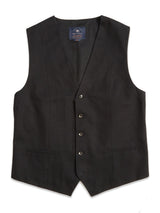 The Canna Carbonio Gillet by Blue de Gênes is a black formal vest featuring five front buttons, two pockets, and a V-shaped neckline, shown against a white background.