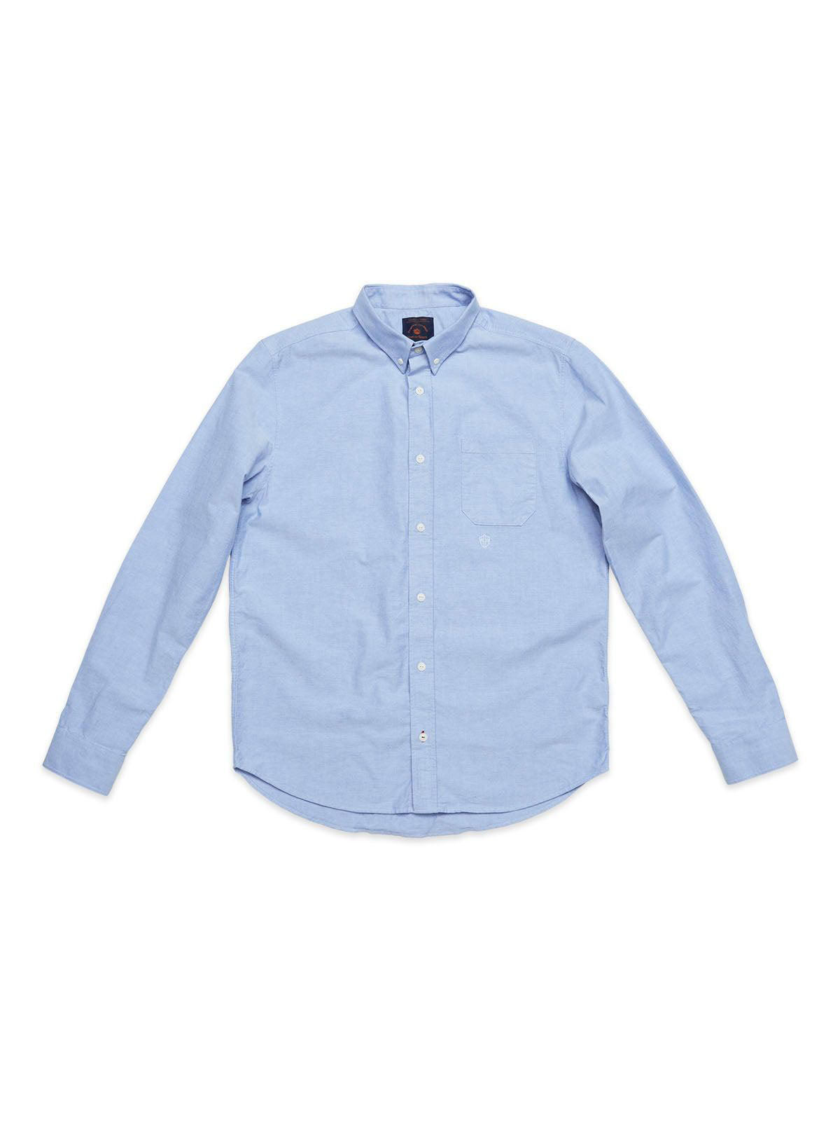 The BGsandro Oxford Shirt - Blue by Blue de Gênes, featuring a light blue color, long sleeves, a classic collar, and a front pocket, is laid flat on a white background.