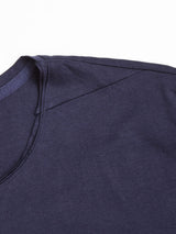 Close-up of the upper section of the Blue de Gênes Sagi Nuovo T-shirt in Dark Navy, highlighting the neckline, shoulder seam, and part of the sleeve against a white background.