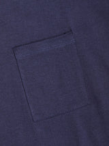 A close-up of the Sagi Nuovo T-shirt in Dark Navy by Blue de Gênes showcases its premium cotton fabric and precise stitching on the small, square chest pocket—an essential addition to any men’s wardrobe.