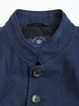 Close-up of the Casella Officers Blazer - Dark Navy by Blue de Gênes, showing the stand collar, two dark buttons, and a partially visible label inside the collar.