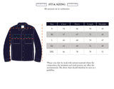 A size chart for the BGBoyd Wool Jacket - Dark Navy by Blue de Gênes is displayed alongside an illustrated shirt, featuring shoulder, chest, sleeve, and length measurements in centimeters for sizes S to XXL—ideal for selecting the right fit when purchasing this durable wool jacket.