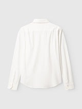 The BGenrico Tessusto Shirt - Chalk by Blue de Gênes is displayed from the back against a light grey background. This shirt features long sleeves, a collar, buttoned cuffs, and is made from honeycomb-textured cotton that adds subtle visual interest.